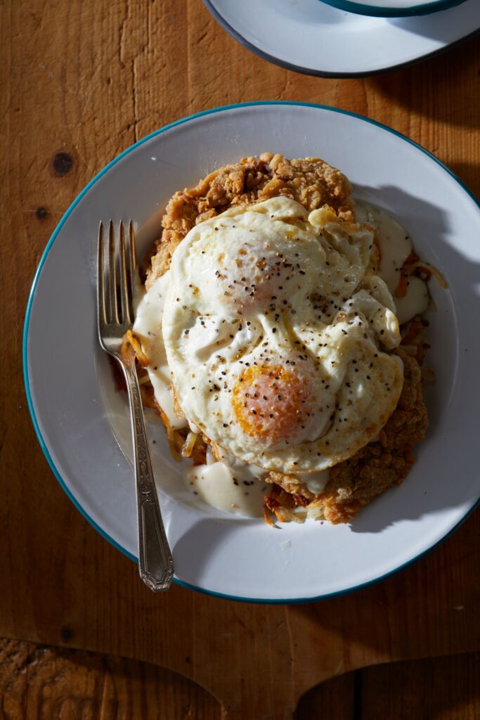 eggs atop chicken-fried steak at emma + ollie